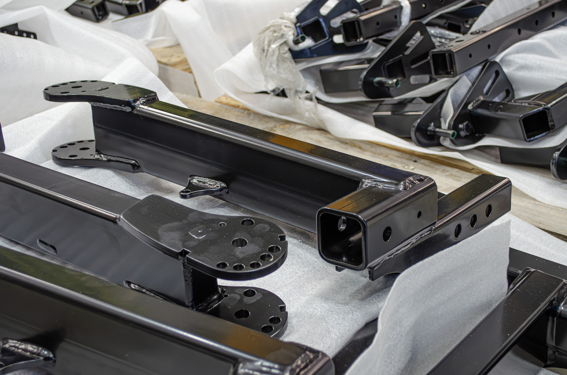 Finished powder-coated steel fabrications packed and ready for delivery from MiWeld